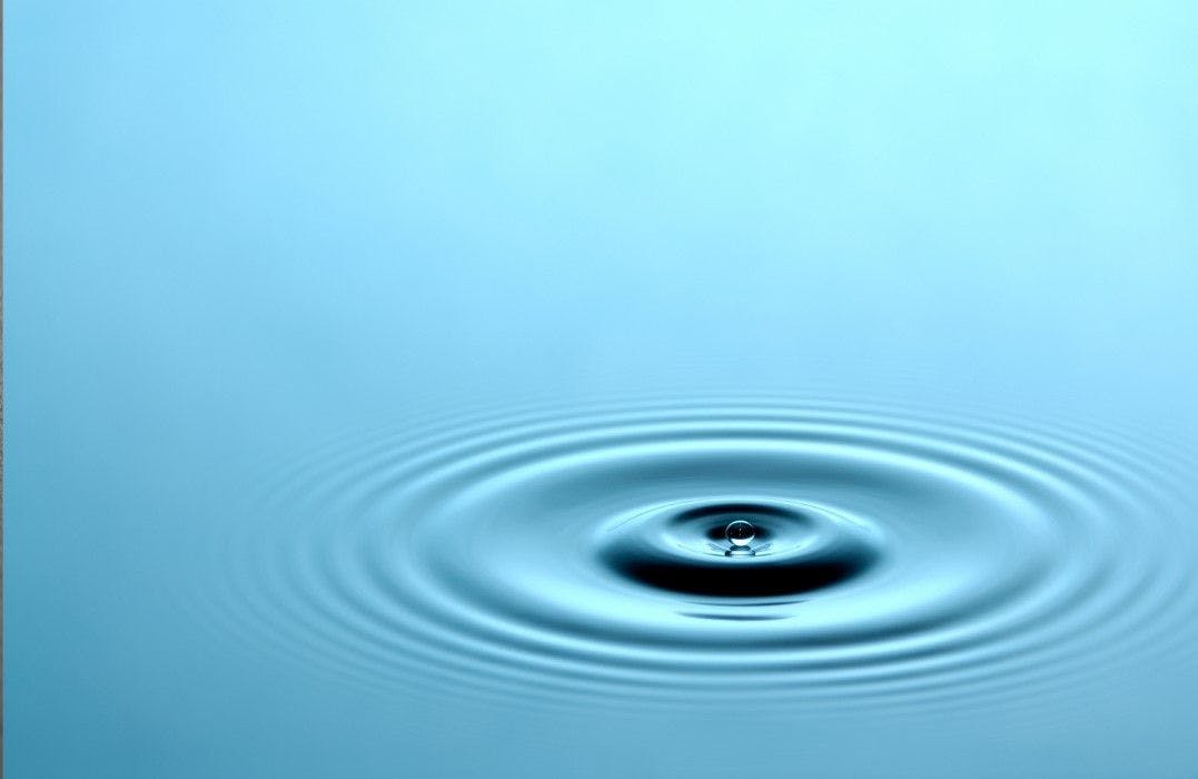 Ripples of a droplet falling in a mass of water